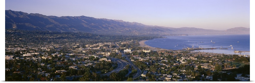 Panoramic photo print of the Pacific Ocean meeting Santa Barbara and the rolling mountains in the distance.