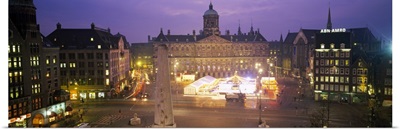 High angle view of a town square lit up at dusk, Dam Square, Amsterdam, Netherlands