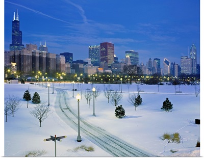 High angle view of snow covered landscape with buildings in the background, Chicago, Illinois
