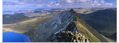 Hikers hiking on a mountain, Striding Edge, Helvellyn, English Lake District, Cumbria, England