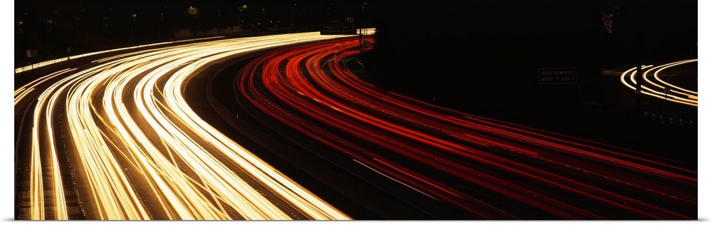 Trails of car lights on the busy Hollywood Freeway in the evening in California.