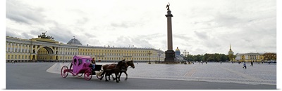 Horsedrawn carriage in front of the General Staff Building, State Hermitage Museum, Winter Palace, Palace Square, St. Petersburg, Russia