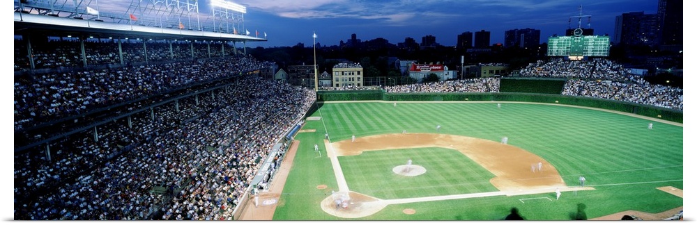 Panoramic photograph taken from the top section behind home plate overlooking historic Wrigley Field.  Over the ivy covere...