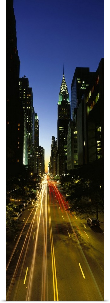 Large vertical panoramic photo of blended car headlights in motion on Lexington Avenue in New York City, New York (NY). Th...