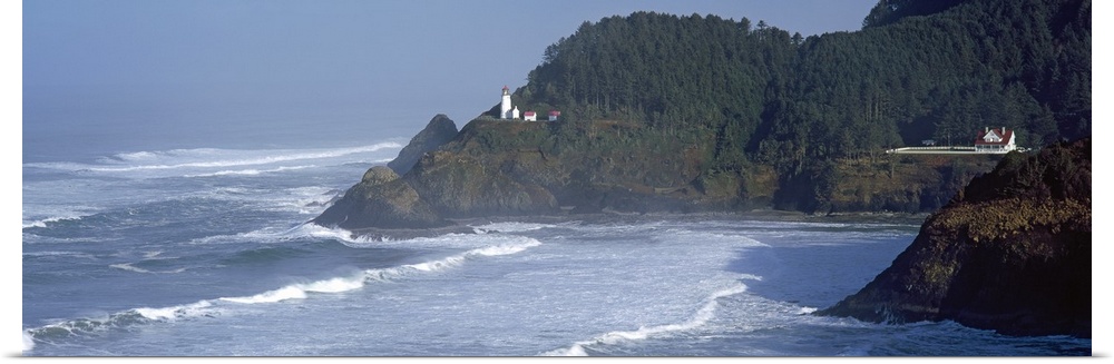 Large, landscape photograph of waves rushing against the shore in Heceta Head, Lane County, Oregon, the Heceta Head Lighth...