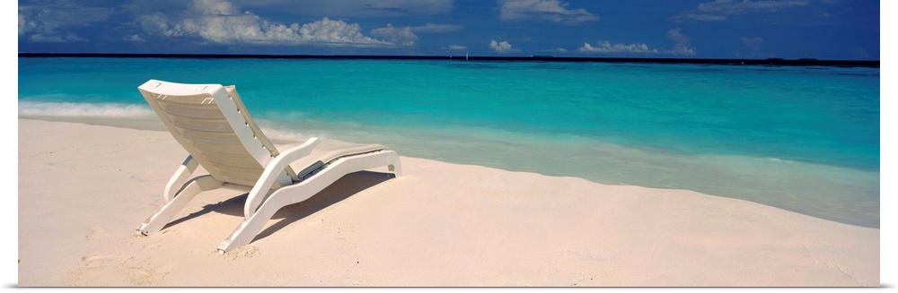 Lounge chair on the beach, Thulhagiri Island Resort, North Male Atoll, Maldives