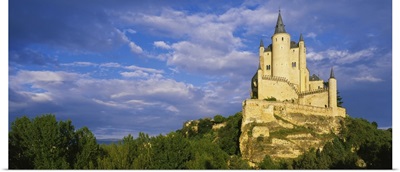 Low angle view of a castle on a hill, The Alcazar Castle, Alcazar, Segovia, Castilla y Leon, Spain