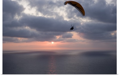 Low angle view of a paraglider flying in the sky over an ocean, Pacific Ocean, San Diego, California