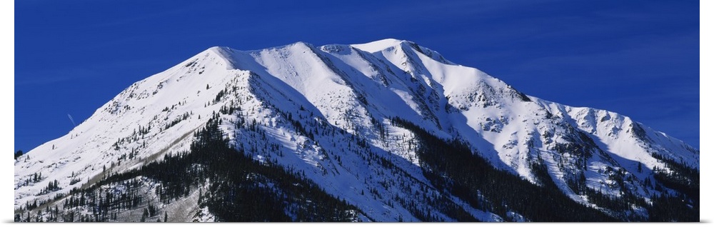 Low angle view of a snow covered mountain, Rocky Mountains, Twin Lakes, Colorado