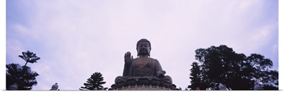 Low angle view of a statue of Buddha, Po Lin Monastery, Lantau Island, New Territories, Hong Kong, China