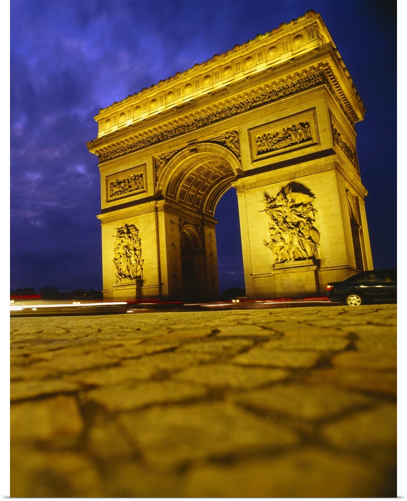 Low angle view of a triumphal arch, Arc De Triomphe, Paris, France