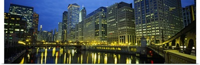 Low angle view of buildings lit up at night, Chicago River, Chicago, Illinois