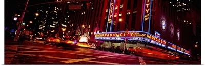 Low angle view of buildings lit up at night, Radio City Music Hall, Rockefeller Center, Manhattan, New York City, New York State