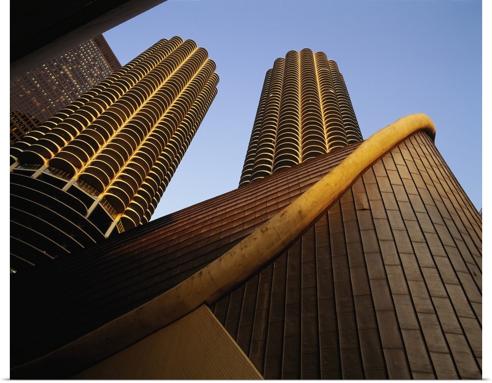 Large photo on canvas of tall buildings seen from below looking up.