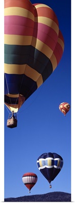 Low angle view of hot air balloons flying in the sky, Angel Fire, New Mexico