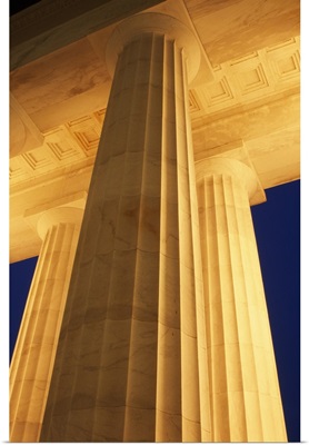 Low-angle view of Lincoln Memorial columns illuminated at night, Washington, District of Columbia