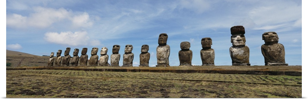 Low angle view of Moai statues in a row, Tahai Archaeological Site, Rano Raraku, Easter Island, Chile