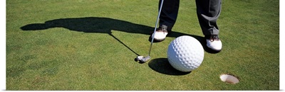 Low section view of a golfer playing golf, San Francisco, California