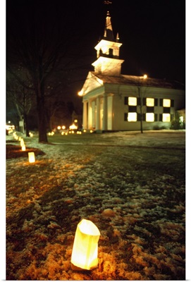 Luminaries outside small church at night, winter, Connecticut