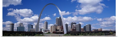 Metal arch in front of buildings, Gateway Arch, St. Louis, Missouri