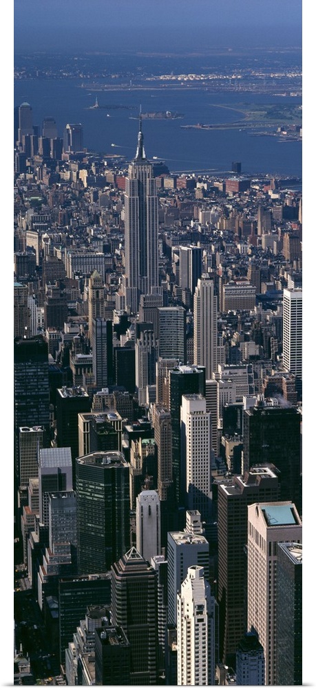 Skyscrapers in New York City are photographed from an aerial view and in vertical orientation.