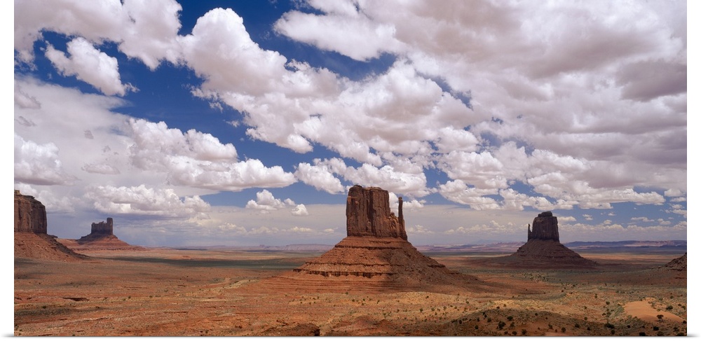Horizontal photo on canvas of rock monuments in a desert in Arizona.
