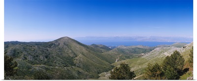 Mountain range with a sea in the background, Corfu, Ionian Islands, Greece