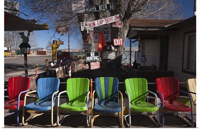 Multi colored chairs at a sidewalk cafe, Route 66, Seligman, Yavapai County, Arizona