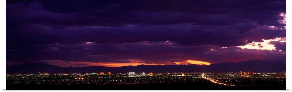 Artwork for the home or office of the Las Vegas strip photographed from a distance with purple toned clouds hovering above...