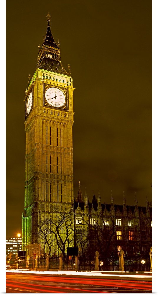 A panorama of London's iconic Big Ben lit up in the evening.