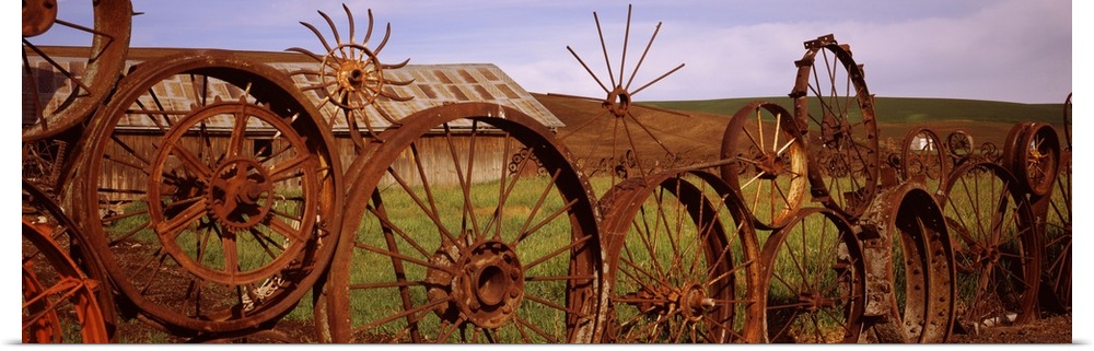 Old barn with a fence made of wheels, Palouse, Whitman County, Washington State,