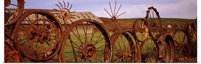 Old barn with a fence made of wheels, Palouse, Whitman County, Washington State,