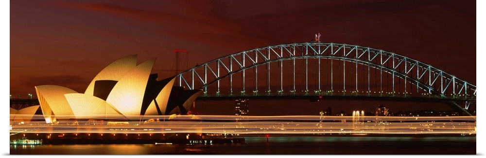 Opera house lit up at night with light streaks, Sydney Harbor Bridge, Sydney Opera House, Sydney, New South Wales, Australia