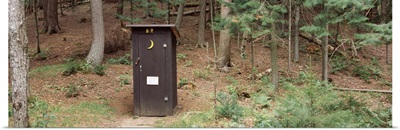 Outhouse in a forest, Adirondack Mountains, New York State,