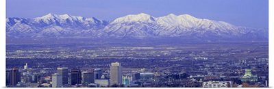 Panoramic sunset of Salt Lake City with snow capped Wasatch Mountains