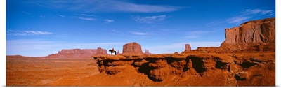 Person riding a horse on a landscape, Monument Valley, Arizona