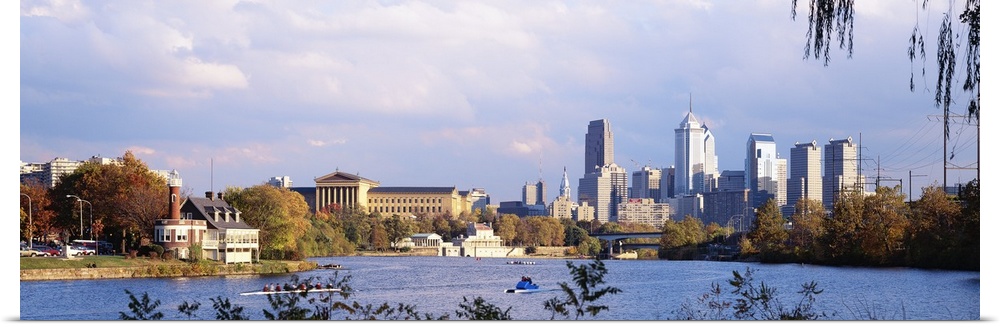 This panoramic photograph includes a view of the city skyline, the art museum, and the Schuylkill River shore.