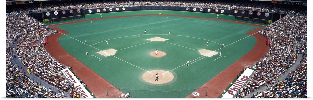 Wide angle photograph of Veterans Stadium in Pennsylvania.  The stands are packed with fans during a Phillies versus Mets ...