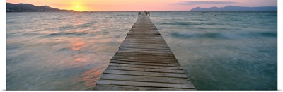 Pier at sunset in the sea, Alcudia, Majorca, Spain