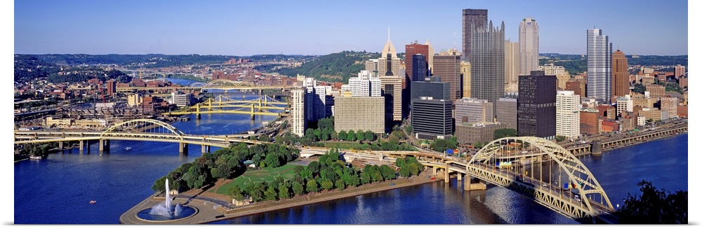 Panoramic photograph of the skyline, bridges, and Point State Park where the three rivers meet.