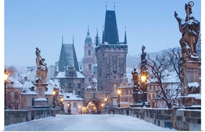 Prague, Charles Bridge tower and St. Nicolas church on winter morning