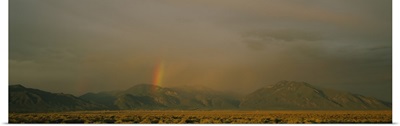 Rainbow in a cloudy sky, Taos, New Mexico