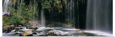 Rainbow in front of a waterfall in a forest, Dunsmuir, Siskiyou County, California
