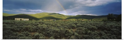 Rainbow over a rolling landscape, Taos, New Mexico