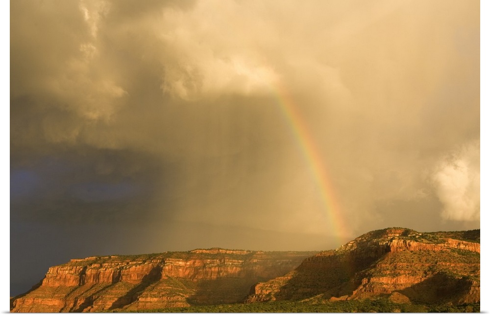Rainbow Over Desert Landscape With Mesas