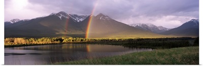 Rainbow over mountain range, Alberta, Canada