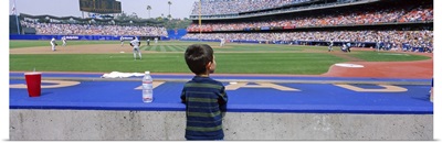 Rear view of a boy watching a baseball match, Dodgers vs. Yankees, Dodger Stadium, City of Los Angeles, California
