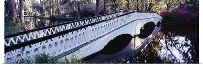Reflection of a bridge in water, Magnolia Plantation and Gardens, Charleston, South Carolina