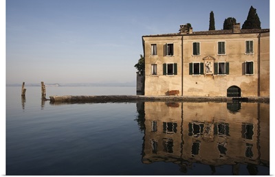 Reflection of building in a lake, Punta San Vigilio, Lake Garda, Garda