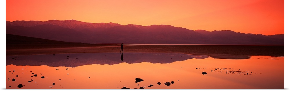 Reflection of mountains in water, Badwater, Death Valley, California,